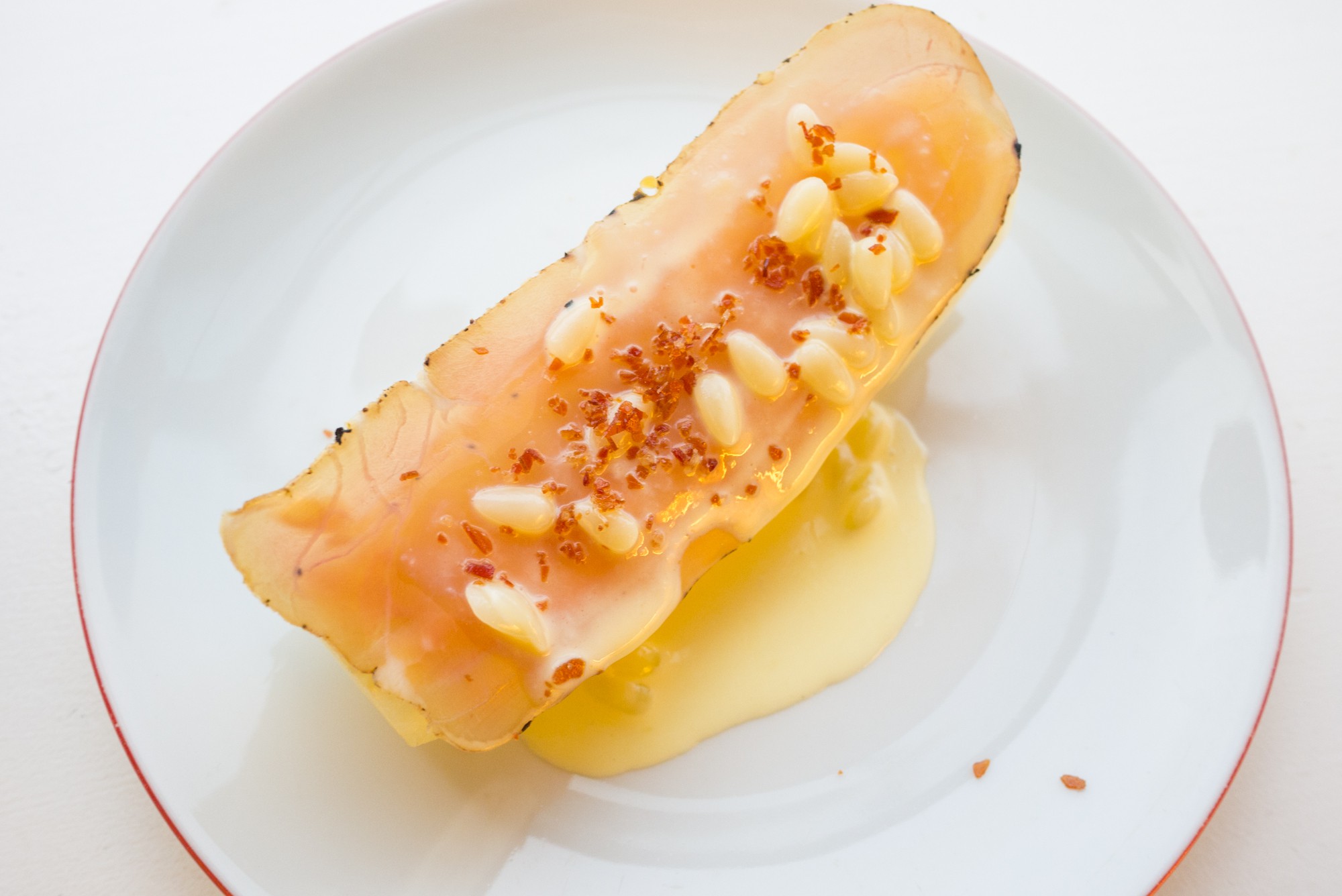 Yellow melon, ham infused cream and salt & edible seeds
